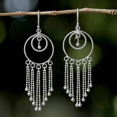 With the appearance of beautiful dream catchers this pair of chandelier earrings is crafted from sterling silver in circular shapes with delicate chain work dangling from each piece. Thai artisan Angels designs the earrings drawing inspiration from the life work of her parents. Chandelier Earrings Diy, Geometric Silver Jewellery, Silver Chandelier Earrings, Silver Jewelry Diy, Silver Jewelry Box, Silver Chandelier, Metal Clay Jewelry, Earrings Hoops, Fine Silver Jewelry