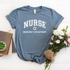 Custom Designed Nurse Emergency Department t-shirt. Direct to garment ink printed. Bella + Canvas brand t-shirt in unisex sizing. Refer to size chart for best fit guide Honor a new nurse graduate, or an experienced front line worker with a t-shirt that recognizes his or her achievements as well as dedication to healthcare. Thank you to every nurse for your dedication!! Pre-shrunk Nursing T-shirt With Crew Neck, Cotton Nursing Friendly T-shirt, Granny Shirts, Science Teacher Shirt, Father In Law Gifts, Principal Gifts, Nurse Tshirt, Librarian Shirt, Typography Shirts