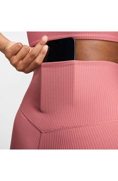 Lightweight InfinaSoft fabric enhances the smooth, freeing feeling of softly ribbed leggings that are ideal for workouts, hangouts and everyday wear. 25" inseam; 8" leg opening; 10 1/2" front rise; 13" back rise (size Medium) Pull-on style Back drop-in pocket Dri-FIT moisture-wicking technology Lined gusset 77% nylon, 23% spandex Machine wash, line dry Imported High Stretch Ribbed Athleisure Pants, Tight Ribbed Athleisure Bottoms, Athleisure Yoga Ribbed Pants, Athleisure Ribbed Yoga Pants, Ribbed Athleisure Yoga Bottoms, Ribbed Tight Workout Bottoms, Tight Ribbed Workout Bottoms, Ribbed High Stretch Athleisure Leggings, Compressive Ribbed Bottoms For Yoga