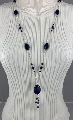 This classic navy blue look of lapis lazuli, highlighted with the sparkle of Swarovski crystals, is hand wrapped onto Sterling Silver chain.  The length is 33'' long plus the 3'' dangle drop. Complimenting earrings are 1 1/4'' long on Sterling Silver ear wires. Lapis Lazuli Jewelry, Lapis Lazuli Necklace, Swarovski Crystal Necklace, Turtle Pendant, Necklace And Earrings Set, Birthstone Bracelets, Bar Pendant, Freshwater Pearl Necklaces, Necklace And Earrings