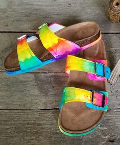 Be bold and be bright! Stand out with NeonTie-Dye Birkenstock-style adjustable slide sandals perfect for the hippie chick! Hand-colored and made to order in women's sizes 6-10. Be bright, be bold, and be colorful in these super comfy and cute tie-dye slide sandals! **Half sizes not available** **Please note these are NOT the Birkenstock brand - they are made from high quality shoe that are just as cute and comfy** Multicolor Slip-on Slides For Summer, Multicolor Slides With Cushioned Footbed, Adjustable Multicolor Flip Flops For Spring, Casual Rainbow Sandals For The Beach, Multicolor Cushioned Slide Sandals, Colorful Slip-on Sandals For Vacation, Fun Multicolor Slip-on Sandals, Rainbow Open Toe Sandals For Summer, Multicolor Cushioned Slides