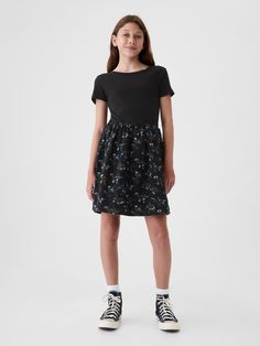 Soft cotton skater dress.  Crewneck.  Short sleeves.  Certain styles have allover prints at the skirt.  This product was made in a factory that invests in gender equality and women’s empowerment.  Through RISE Reimagining Industry to Support Equality) and Gap Inc. ’s program P. A. C. E.  Personal Advancement & Career Enhancement), we support people who make our clothes to build the skills, knowledge, confidence, and resilience needed to advance in work and life.  Learn more here.  Fit and flare Gap Cotton Mini Length Dress, Casual Cotton Twirl Dress With Short Sleeves, Casual Cotton Fitted Twirl Dress, Casual Cotton Mini Dress By Gap, Casual Short Sleeve Mini Dress By Gap, Casual Cotton Fit And Flare Dress, Casual Cotton Fit And Flare Mini Dress, Casual Black Dress By Gap, Casual Black Gap Dress