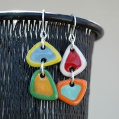 These colorful asymmetric earrings will brighten your day. Put a touch of color on your face and enjoy life! *DETAILS: - All my ceramic pieces are painted by hand with a brush and ceramic glazes, then I put the pieces in a ceramic kiln where they are fired for several hours over low heat so that they stay perfect. * MEASURES Ceramic piece 2,8 cm (1.1") x 1,5 cm (0.59'') x 0,3 cm (0.12'') Total drop length 4,3 cm. (1.7'') *MATERIALS: High quality materials. Hypoallergenic. I use black clay and no Modern Multicolor Earrings For Everyday, Playful Everyday Drop Earrings, Earrings Funny, Ceramic Kiln, Ceramic Earrings, Earrings Colorful, Colorful Ceramics, Ceramic Earring, Black Clay