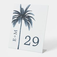 a card with a palm tree on it and the number twenty nine in front of it