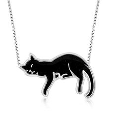 a black and white cat necklace on a chain