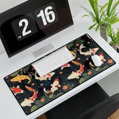 a computer desk with a clock on it and a mouse pad sitting next to it