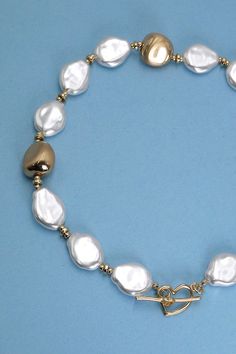 Take a new spin on a classic Pearl necklace with toggle closure a mix necklace that will go well with your romper or puff hem dress. DIMENSIONlength: 15"charm size: .75" Toggleclasp: toggle closuremetal finish: matte Plated, pearlproduct: Lead & Nickel Compliantanti-tarnish: Double E-coating Heart Toggle Necklace, Matte Plates, Classic Pearl Necklace, Beaded Heart, Toggle Necklace, Toggle Clasp, Metal Finishes, Hem Dress, How To Better Yourself