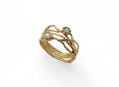 Gold Opal ring. White opal gold ring. Organic design Opal ring. Branch gold ring. Opal jewelry. Gift for her♥ About The Ring:This dainty artisan ring is made by hand from a combination of fine nature inspired twigs, integrated as branches of a marvelous tree, from which stems two gentle shy Opal flowers.The ring is made of 14K solid gold with lab made white opals.Metal: 14 k solid yellow goldThe width is 9 mm at The top (widest part).♥ Shipping Info:All rings are packaged and shipped in a beauti Gold Ethiopian Opal Ring For Anniversary, Gold Ethiopian Opal Ring Fine Jewelry, Unique Opal Gold Rings, Gold Opal Ring In 14k, Unique Gold Opal Rings, Unique Gold Opal Ring In 14k, Anniversary Ethiopian Opal Ring In Gold, Gold Opal Multi-stone Ring, Unique Yellow Gold Ethiopian Opal Ring