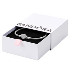 PRICES MAY VARY. Snake Chain Heart Bracelet: Set your heart a-flutter with this romantic PANDORA charm bracelet; pair it with other PANDORA bracelets for a multi-layered look Compatible with PANDORA Moments: PANDORA Moments is a way to say something about who you are through every charm and bracelet you choose and how you choose to wear it Features CZ: Cubic zirconia could be said to be the jewel in PANDORA's crown, making up the majority of stones we use in our jewelry because it optically look Crown Making, Pandora Collection, Chain Heart, Snake Chain Bracelets, Gold Charm Bracelet, Pandora Charm, Broken Chain, Pandora Bracelets, Pandora Bracelet