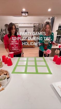 two women standing in front of a table with food on it and the words 8 party games to play during the holidays