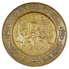 a gold plate with an image of people on it