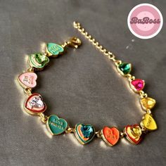 Elevate your style with our exquisite Enchanting Harmony: Vibrant Love Heart Bracelet - a celebration of love and color that captivates hearts and turns every moment into a magical experience. Whether you're stepping out for a casual day with friends or adding a touch of charm to a special occasion, this bracelet effortlessly complements your style. Its versatile design allows you to express your personality with ease. Multicolor Jewelry For Valentine's Day Party, Gold Bracelets For Valentine's Day Party, Valentine's Day Party Multicolor Jewelry, Heart-shaped Multicolor Bracelets For Mother's Day, Gold Heart Bracelet For Valentine's Day Party, Multicolor Jewelry For Wedding And Valentine's Day, Party Heart Beads Charm Bracelet, Party Heart Shape Charm Bracelet With Heart Beads, Heart-shaped Bracelet For Valentine's Day Party