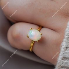 Gemstone : Natural Ethiopian Opal Metal : 9K Gold / 14K Gold / 18K Gold / 925S Silver Gemstone Shape and Size : Oval 9x7 MM Gemstone Weight : 2.10 Cts Metal Weight :  3.00 Gram ACCEPT CUSTOM SERVICE: 1. Accept change main stone type, size : Oval 9x7 MM 2. Accept change other material : This jewelry can also be made in solid gold (14K white/rose/yellow gold...) Please contact me if you have special requests. Thanks for your visiting! Gold Opal Ring Fine Jewelry, Fine Jewelry Gold Opal Birthstone Ring, Gold Opal Birthstone Ring For Anniversary, White Opal Birthstone Ring In 14k Gold, Gold Opal Ring With Round Cut, 14k Gold White Opal Birthstone Ring, White Gold Solitaire Opal Ring Gift, Heirloom Gold Opal Gemstone Ring, Gold 14k Opal Ring As Gift