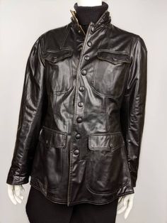 "Classic fitted WW2 style jacket from JEAN PAUL GAULTIER. Fully snaps down the middle to a high collar on neck. Two front pockets which also snap button closed. Hourglass fit with larger shoulders that make the waist even more defined. Size USA 10/M (See the measurements) Condition 8/10 (Slightly rubbed 3 buttons on the pockets, there are 2 cracks at the bottom) Made in ITALY Underarm to underarm - 42cm/16,5\" Length from the back - 66cm/26\" Sleeve length from seam - 63cm/24,8\" Sleeve length f Business Leather Jacket With Stand Collar And Pockets, Fitted Biker Jacket With Flap Pockets For Fall, Classic Fitted Brown Utility Jacket, Fitted Classic Brown Utility Jacket, Classic Long Sleeve Outerwear With Button Zip Fly, Winter Leather Utility Jacket With Flap Pockets, Winter Fitted Leather Jacket With Button Closure, Fitted Winter Biker Jacket With Flap Pockets, Fitted Biker Jacket With Flap Pockets For Winter