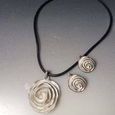 Silver Rose Pendant On A Black Cord Necklace Adjustable With Matching Pierced Rose Earrings Set. 16in To 18in New Without Tags New To Poshmark? Use This Code Tobyoshi 1028 For $10 Dollars Off Your First Purchase In Any Closet! Buy Now Before This Offer Expires .Tobyoshi 1028 For Free $10 Off Silver Metal Jewelry With Rose Design, Silver Metal Necklace With Rose Design, Silver Necklace With Rose Design, Silver Rose Design Metal Necklace, Silver Rose Design Necklace, Adjustable Rose Sterling Silver Jewelry, Adjustable Sterling Silver Jewelry In Rose Color, Black Cord Necklace, 10 Dollars