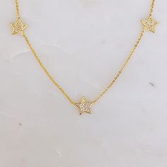 Our Stars In Greek Island Necklace offers the perfect balance of sparkles and delicateness for any occasion. The three shining stars are set in a dainty golden chain, giving you the chance to dazzle yet stay subtle. Shine bright! 16” long with a 2" extender 18 k gold plated brass, cubic zirconia Lead and Nickel free Made in China Golden Chain, Hair Setting, Shining Star, Greek Island, Scrunchie Hairstyles, Steel Jewelry, Star Necklace, Stainless Steel Jewelry, Hair Accessories Headbands