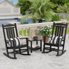 three rocking chairs sitting on top of a patio next to a pool