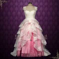 This Barbie Pink Ombre Lace Tiered Ball Gown Wedding Dress ERIS is the perfect choice for a unique and stunning wedding. The tiered lace skirt features a beautiful ombre effect in a vibrant Barbie pink color. Make a statement on your special day with this one-of-a-kind ball gown dress. Silhouette: Ball Gown Primary Fabric: Lace Style: Princess Closure: Corset Made to Order: 8 - 12 wks Rush Orders and Customizations: Contact Us Spider Oc, Barbie Pink Color, Brides Maid Gown, Bride Maids, Hot Pink Weddings, Modest Neckline, Ball Gown Dress, Ombre Lace, Pink Wedding Dress