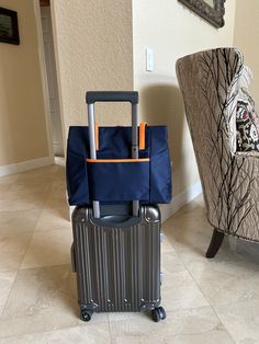 a piece of luggage sitting on the floor next to a chair