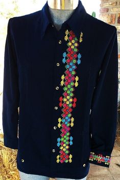 GUAYABERA 100% COTTON MANTA PRE-WASH NAVY BLUE color, with MULTICOLOR geometric embroidery This GUAYABERA is a must in any man's closet! 100 % Cotton Manta Long Sleeve Embroidery on one of the sleeve cuff Classic Collar Pre-washed This is the perfect guayabera for any occasion! Care instructions: This beautiful item was handmade. To maintain the quality of the work, we recommend Machine or hand wash in cold water and hang to air drying. Casual Dress Shirt, Sleeve Embroidery, Men Closet, Geometric Embroidery, Shirt Dress Casual, Sleeve Cuff, Navy Blue Color, Mens Navy, Handmade Artisan