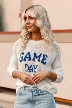 Product Details This incredibly soft and cozy crew features the phrase "Game Day" knit directly into the center front. With a relaxed fit and raglan sleeves this sweater has a sporty look. Additional details include ribbing on the neckline, cuffs and hem. Details & Fit Crew neck Light-weight cozy sweater knit Wide rib at neckline, cuff, and hem Raglan sleeve Length from shoulder to hem: 24" (size small) Materials & Care 76% acrylic, 12% mohair, 12% wool Machine Washable Spring College Sweater With Ribbed Cuffs, Casual Knit Sweater With Letter Print, Sporty College Sweater For Spring, White Fall Sweater For College, Sporty Sweater With Ribbed Neckline For Spring, Leisure Winter Sweater With Letter Print, Winter Leisure Sweater With Letter Print, Cozy Fit Soft Knit Crew Neck Sweatshirt, Sporty Knit Sweatshirt For Loungewear