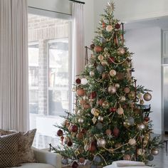 a decorated christmas tree in a living room