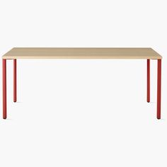 a wooden table with red legs on a white background