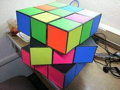 a rubik cube sitting on top of a desk