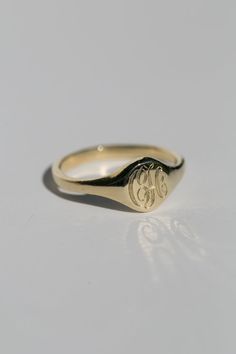 A classic hand engraved monogram ring. Solid 14k recycled gold. Signet face is 7.8mm round, and tapers to a 2.2mm band. 1-2 letters of your choosing engraved into the face. If you would like diamonds or other small birthstones inlaid into the ring, contact us here with the special request. This ring is made to order, please allow 3-4 weeks for delivery. Pinky Signet Ring, Fall Rings, Customizable Jewelry, Monogram Ring, Signet Rings, Family Jewels, Gold Signet Ring, Pinky Ring, Recycled Gold