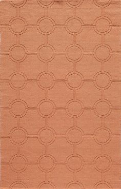 an orange area rug with circles on the front and back of it in various sizes