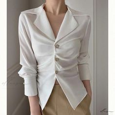 Elluis - Elegantly Refined: Sophisticated and Figure-Enhancing White Blouse Elegant Tailored V-neck Top, Elegant Semi-formal Tops With Lapel Collar, Chic Semi-formal Blouse With Lapel Collar, Chic Blouse With Lapel Collar For Office, Chic Office Blouse With Lapel Collar, Elegant Fitted Blouse, White Office Lady Blouse For Party, Fitted Solid Color Elegant Blouse, Modern Formal Solid Color Blouse