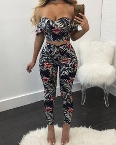 This super sexy fitted pant set is sure to be a new favorite in your wardrobe. Featuring a strapless fitted cropped top with a bottom v-cut and skinny pants with a zippered back and a v-cute front. Pair with statement jewelry and wedges or heels to rock this fabulous look. Comes in 2 fabulous floral color patterns from which to choose. Chic Off-shoulder Spring Sets, Fitted Off-shoulder Summer Set, Casual Off-shoulder Sets, Casual Bandeau Sets For Spring, Floral Print Strapless Jumpsuit For Summer, Summer Strapless Stretch Set, Spring Floral Print Strapless Jumpsuit, Trendy Two-piece High Waist Sets, Trendy Strapless Denim Jumpsuit