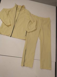 "Vintage seventies athletic wear a two piece warm up - work out suit. Pants and jacket. Owned by a tennis player but useful for many activities - and just to be good looking & comfortable! Pale yellow with navy blue zippers. Overall condition very good, a light discolored mark on pants - see close up. Jacket Length 25.5\" Chest 40\" Waist 38\" Hem 42\" Sleeve 24\" +/- Pants Waist 29-33\" Hips 43\" Rise 13.5\" Inseam 29\" Waist to hem 39.5\" wt22oz 2lb to ship" Running Suit, Tennis Player, Golf Fashion, Vintage Kimono, Suit Pants, Cotton Skirt, Inspired Dress, Tennis Players, Pale Yellow