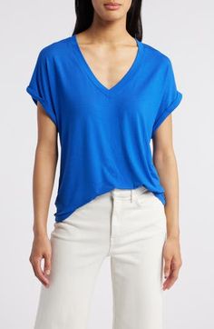 A roomy fit and cuffed sleeves amp up the low-key vibe of this V-neck T-shirt made from a soft and drapey Tencel® modal-blend. 25" length (size Medium)   V-neck   Short sleeves   67% Tencel® modal, 28% polyester, 5% spandex   Tencel modal is a sustainably produced fiber made with closed-loop processing and is certified with the EU Ecolabel as having a low environmental impact throughout the entire lifecycle   Dry clean or machine wash, tumble dry   Imported   Women's Clothing Blue Top With Rolled Sleeves For Everyday, Blue Tops With Rolled Sleeves For Everyday, Everyday Blue Tops With Rolled Sleeves, Relaxed Blue V-neck Top, Relaxed Blue Tops With Shirttail Hem, Blue Tops With Rolled Sleeves And Shirttail Hem, Environmental Impact, Kauai, Low Key