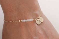 * High Quality ethiopian opal rose gold Filled chain,sterling silver chain     Gold Filled Chain. Initials Disc Bracelet.      Infinity Couple Jewelry *Length is adjustable from 6 1/2 to 7 1/4 inches.  *Disc:High quality rose gold filled, gold filled, sterling silver disc hand stamp initial *Genuine Moonstone How to request letters 1.add to cart 2.pay 3.You can write initials (letters) in the notes you make after the pay   *Item comes packaged in a gift box. *Tracking # will be given to all orders.  *Please check out the other jewelry in my shop:   https://www.etsy.com/shop/dorocy *If you have any questions, feel free to ask me! Gold Moonstone Beaded Bracelet As A Gift, Elegant Moonstone Beaded Bracelets As Gift, Elegant Moonstone Beaded Bracelet As Gift, Elegant Opal Beaded Bracelets As Gift, Adjustable Rose Gold Opal Jewelry, Elegant Adjustable Opal Beaded Bracelets, Opal Beaded Bracelets For Gifts, Disc Bracelet, Diy Jewlery