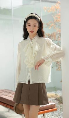 Chiffon blouse with a button down front lined with pearl buttons, ruffled Victorian front, frilly cuffs and lace trims all over. S: 14" across shoulders, 36" chest, 23" lengthM: 14.5" across shoulders, 37.5" chest, 23" lengthL: 15" across shoulders, 39" chest, 23" length Spring Button-up Blouse With Lace Collar, Spring Blouse With Lace Trim And Ruffled Collar, Lace Blouse With Button Closure For Work, Formal Blouse With Lace Trim And Ruffled Collar, Classic Cream Blouse With Lace Collar, Elegant Ruffle Sleeve Cotton Blouse, Elegant Doll Collar Blouse For Spring, Daywear Collared Blouse With Ruffles, Feminine Blouse With Doll Collar And Ruffles