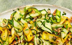 zucchini and squash salad on a white plate