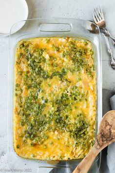 a casserole dish with broccoli and cheese in it on a table