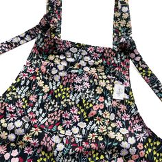 🌸❤️🧵 HANDMADE FLORAL DUNGAS! 🧵❤️🌸  These relaxed fit dungarees are made from poly cotton fabric, are fully lined and have adjustable tie fastenings at the top.  Long dungarees come with 5 pockets - 1 bib and 2 side pockets on the front and 2 side pockets on the back.  Short dungarees come with 3 pockets - 1 bib pocket on the front and 2 side pockets on the back.  Dungaree dress come with 3 pockets - 1 bib pocket and 2 side pockets on the front. If you would prefer different pocket placement Casual Cotton Overalls With Tie Straps, Casual Overalls With Tie Straps And Bib Front, Cotton Jumpsuit With Adjustable Straps And Bib Front, Cotton Overalls With Tie Straps, Cotton Jumpsuits And Rompers With Adjustable Straps, Cotton Sleeveless Overalls With Tie Straps, Spring Overalls With Adjustable Straps And Relaxed Fit, Sleeveless Cotton Overalls With Tie Straps, Spring Overalls With Adjustable Straps In Relaxed Fit