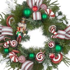 a christmas wreath decorated with ornaments and candy canes