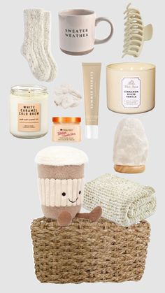 the contents of a basket with candles, towels and other items