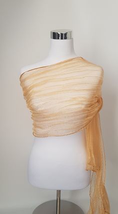 Gold Organza Shawl. Pls note this shawl is a strong gold colour. See the other listing for light gold to compare.  Stunning shawl, light weight. To achieve the crushed look the shawl is twisted whilst wet and tied with a rope and left to dry. Beautiful shawl, will make any outfit look glamorous. Keep it or gift it.  Care Instructions Hand wash mild detergent Hang to dry naturally  Crush will remain as long as you don't iron. If you want to remove the crush affect on shawl just iron with cloth on top.  Plz note, once ironed the crush effect will not return. Thank you  Size is approximate. 200cm Length, 50cm Width Colour on monitor is not accurate Colour may vary, very slightly on each shawl Available in many colours Organza Shawl, Gold Veil, Gold Shawl, Gold Organza, Colour Wedding, The Crush, Gold Scarf, Emerald Dresses, Modest Fits