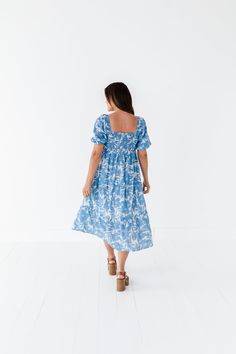 Features Square neckline Puff sleeves with elastic cuff Tiered skirt Ivory with blue floral print Pockets 60% Cotton, 40% Polyester; Lining: 100% Polyester Size + Fit Small 0-4, Medium 4-8, Large 8-12, 1X 12-16, 2X 16-20, 3X 20-24 Kristin is 5'4", a size 1 and is wearing a Small Jayce is 5'6", a size 18 and is wearing a 2X Runs true to size Measurements taken while laying flat and doubled. Bust measurements do not account for stretch. Click here for shoes shown in photos Size Bust Length Small 2 Curvy Swim, Christmas In July Sale, Blowout Sale, Curvy Dress, Blue Floral Print, Resort Collection, Black Sand, Shoe Show, Tier Skirt