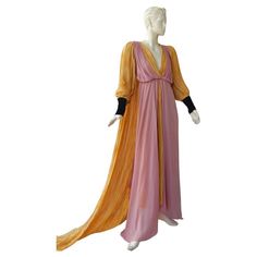 Stunning medieval-inspired Gucci runway gown designed by Alessandro Michele. Wonderful color combination of soft gold and plum pink silk finished with sumptuous black silk velvet cuffs with matching covered buttons. Slight empire waist design boasts handkerchief folds, offset by dramatic knife pleating train. Very reminiscent of Fortuny-style fashion. Fully lined with back zipper closure. Condition: brand new with tags Size: 38 Bust: 32" Waist: 26";Hip: 38"; length: approx. 60” Gucci Runway, Runway Gowns, Silk Handkerchief, Handkerchief Hem Dress, Alessandro Michele, Vestidos Vintage, Handkerchief Hem, Silk Velvet, Pink Silk