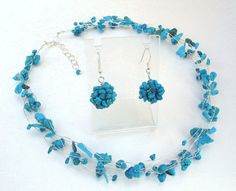 "Turquoise Blue Necklace and Earrings, Bridesmaid Jewelry Set, Silver Gemstone Jewelry, summer nautical colors weddings accessories A bridesmaid jewelry set of a sweet and petite blue turquoise short necklace made of non-tarnish silver wire, wrapped with 6-rows of genuine, natural turquoise stone chips and a matching pair of earrings, (like the ones listed individually here: http://www.etsy.com/listing/83412744/autumn-fall-fashion-crochet-knitted Made to Order will ship in 1-2 weeks It is 15-16\