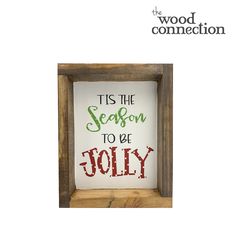 a wooden frame with the words tis the season to be jolly in red and green