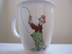 a white coffee cup with a drawing of a man holding a fishing rod