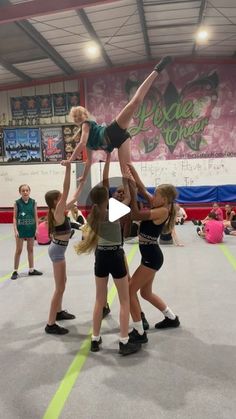 a group of young women standing on top of each other