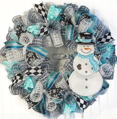 a wreath with a snowman on it