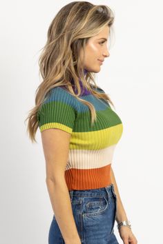 *SIGN UP FOR RESTOCK NOTIFICATIONS, ITEMS ARE RESTOCKED WHEN POSSIBLE BASED ON DEMAND* DESCRIPTION 55% Viscose, 30% Polyester, 15% Nylon Mock neckline, Ribbed, Multicolor stripes, Fitted with stretch Naomie is wearing a size small Height | 5'8 Dress size | 2 Please note: All items purchased on sale are final sale. We recommend checking your cart for sale items to make note of non-returnable items Fitted Casual Mock Neck Top With Ribbed Neckline, Trendy Fitted Ribbed Mock Neck Top, Trendy Color Block Knit Top, Retro Ribbed Striped Tops, Retro Striped Ribbed Tops, Trendy Multicolor Crew Neck Knit Top, Fall Color Block Turtleneck Tops, Green Ribbed High Neck Top, Striped Stretch Turtleneck Top